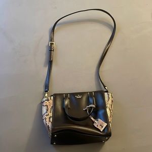Kate Spade mini purse with straps. Pink crocodile siding. Dark brown leather.